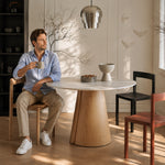 Load image into Gallery viewer, Modern Round Dining Table with Walnut Veneer Top & Travertine-Inspired Pedestal Base