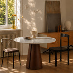 Load image into Gallery viewer, Modern Round Dining Table with Walnut Veneer Top & Travertine-Inspired Pedestal Base