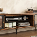 Load image into Gallery viewer, Wooden entertainment console with electronic devices and books on a neutral background