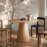 Load image into Gallery viewer, Modern Round Dining Table with Walnut Veneer Top & Travertine-Inspired Pedestal Base