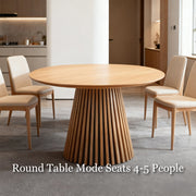 46.8'' Extendable Round-to-Oval Wooden Dining Table with Sculptural Fluted Base