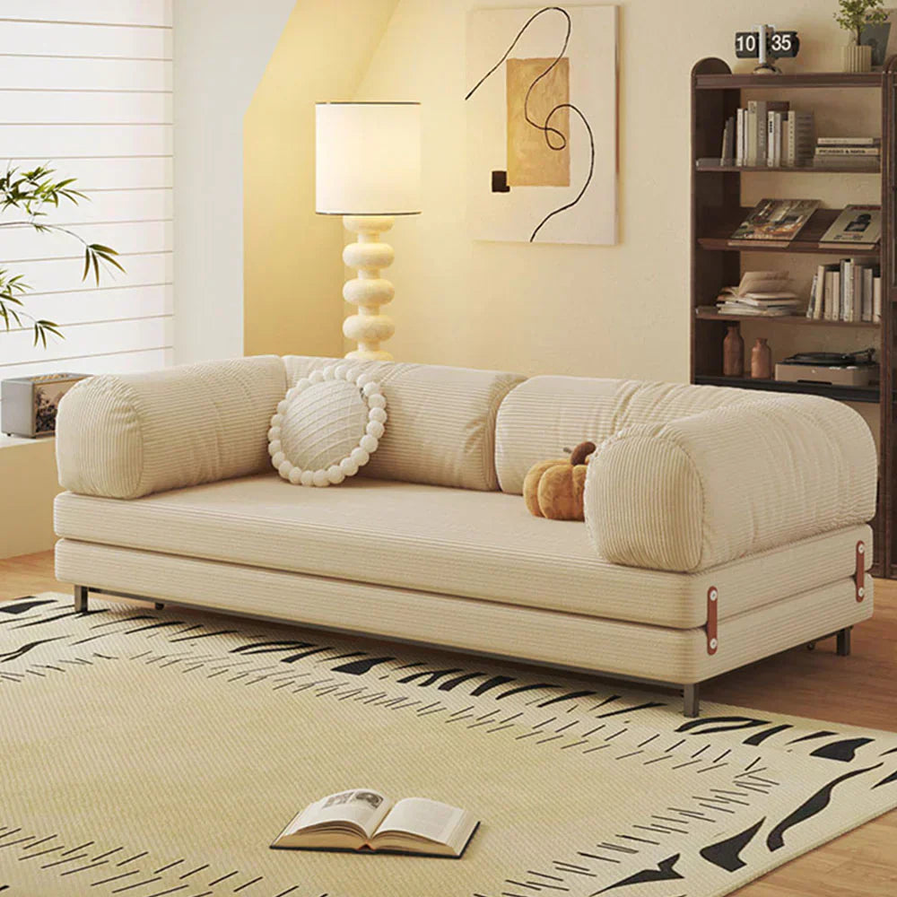Beige sofa bed styled for a modern minimalist living room, featuring textured corduroy fabric and a calm neutral palette.