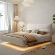 white floating bed with LED lights