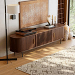 Load image into Gallery viewer, Wooden mid century tv stand with decorative items in a living room setting
