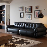 Modern Black Tufted Leather Sofa Minimalist Deep Seat Couch with Sculptural Armrests