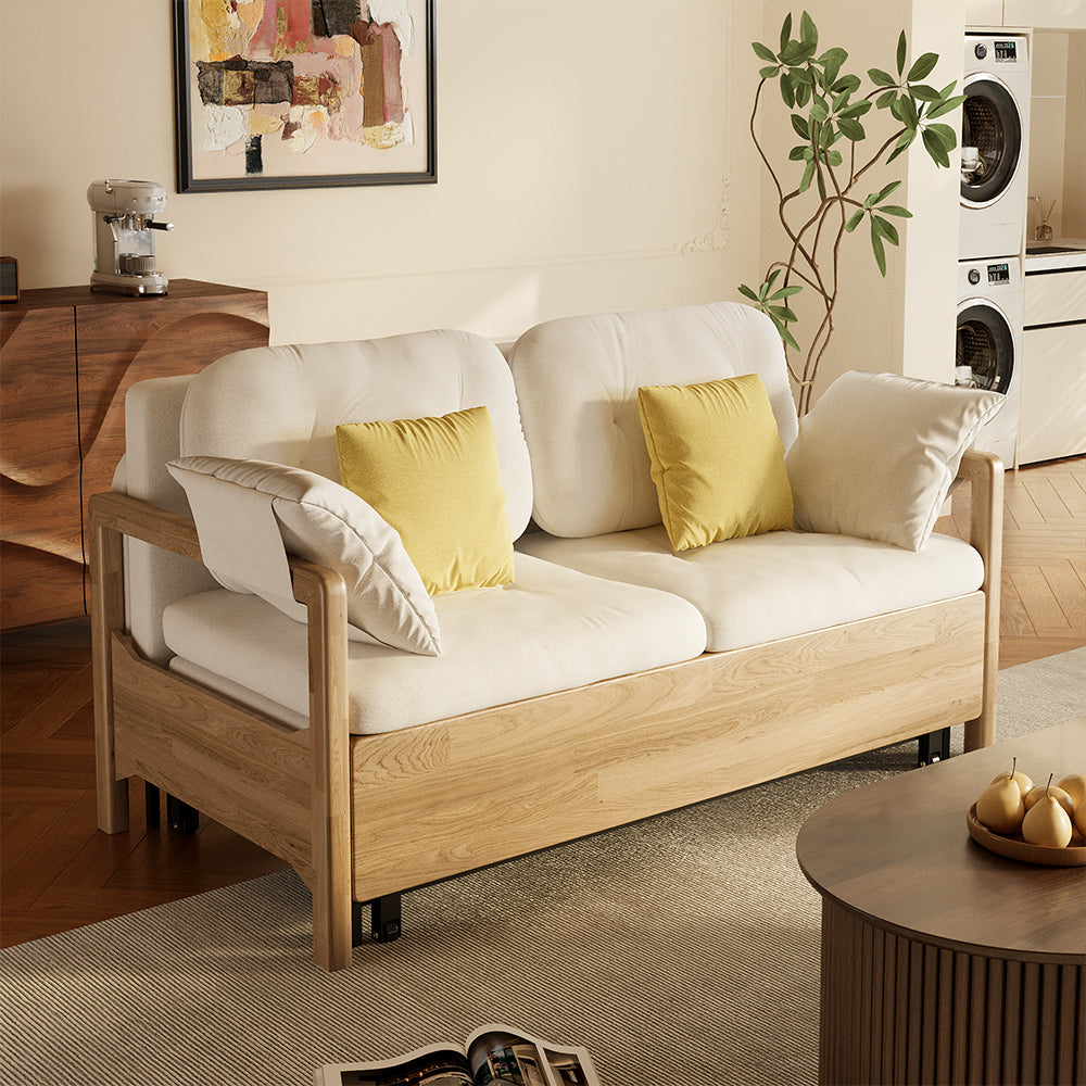 Beige sofa bed with a solid wood frame and pull-out design, styled in a calm, modern living space with natural light.