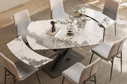 Extendable dining table with marble-look tabletop expanded for additional seating