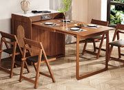 Murphy-style fold-out dining table converting from a compact cabinet into a full dining setup