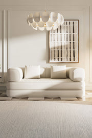 Sleeper sofa in closed position used as everyday seating in a neutral interior